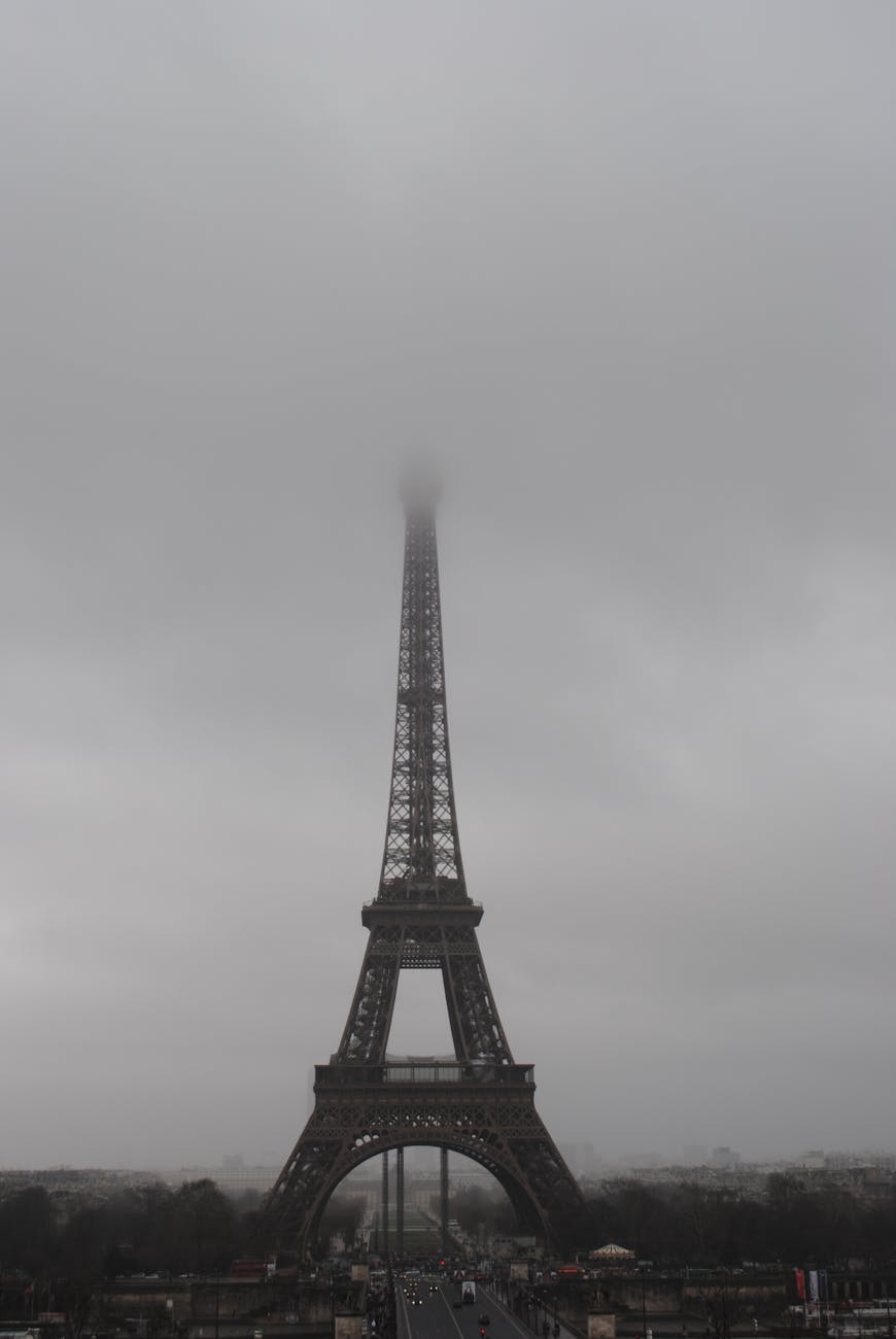 eiffel tower in paris under grey clouds